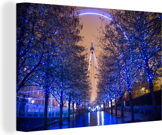 De gekleurde London Eye tussen de bomen in Londen Canvas 140x90 cm - Foto print op Canvas schilderij (Wanddecoratie woonkamer / slaapkamer)