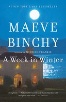 Boekcover van Maeve Binchy's 'A Week in Winter' met een stenen huis bij maanlicht.