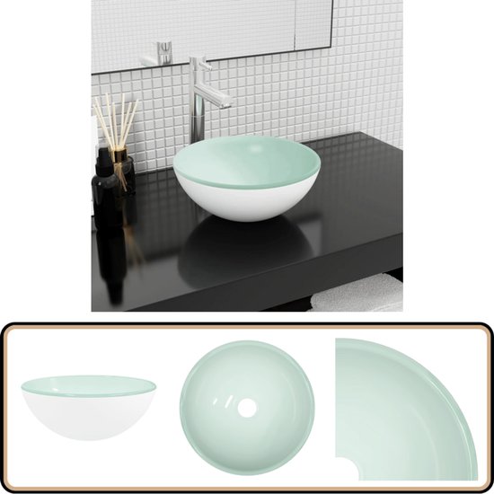 Lavabo blanc avec bord vert clair, robinet et carrelage blanc.