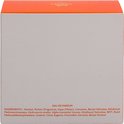 Zij-aanzicht van de Elixir des Merveilles eau de parfum doos met oranje onderkant. Toont ingrediëntenlijst.