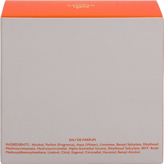 Zij-aanzicht van de Elixir des Merveilles eau de parfum doos met oranje onderkant. Toont ingrediëntenlijst.
