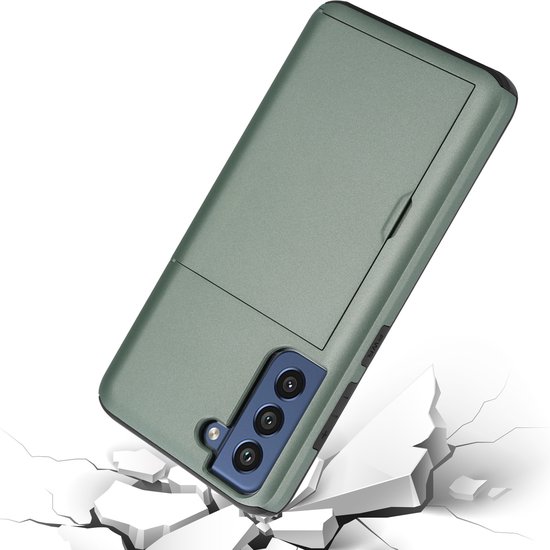 Groene ShieldCase telefoonhoes met schuifvak, vallend op gebroken tegels, symboliseert bescherming.