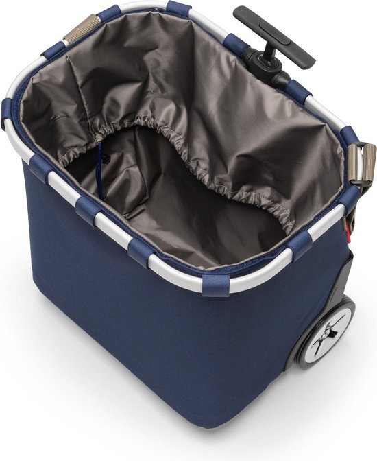 Binnenkant van een donkerblauwe boodschappentrolley met zilverkleurig frame en grijze binnenvoering met trekkoord.