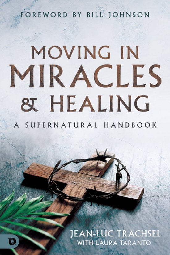 Boek 'Moving in Miracles & Healing' met een houten kruis en doornenkroon, voorwoord van Bill Johnson.