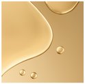 Abstracte weergave van gouden olie druppels en golven op een gouden achtergrond.