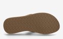 Onderkant van een cognacbruine Reef slipper met een visgraatprofiel.