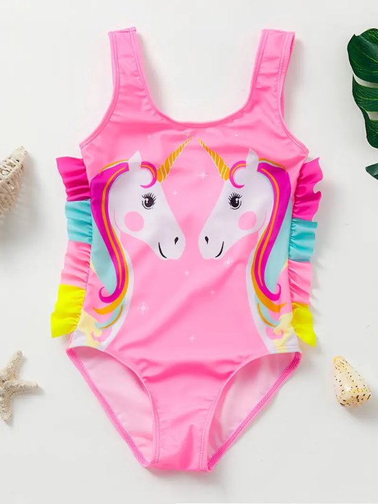 Roze badpak met twee eenhoornprints, glitters en regenboogkleurige ruches aan de zijkanten.