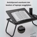 Gestreepte laptoptafel met een boek en een antisliprand. De antisliprand voorkomt dat boeken wegglijden.