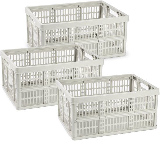 Drie beige opvouwbare kratten met een open, geperforeerd design, gestapeld.
