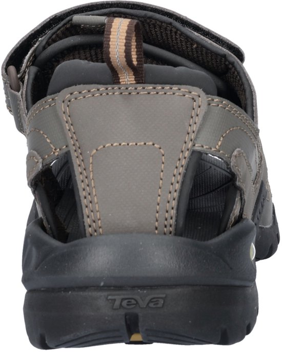 Achterkant van grijze Teva sandalen met "Teva" logo op de zool.