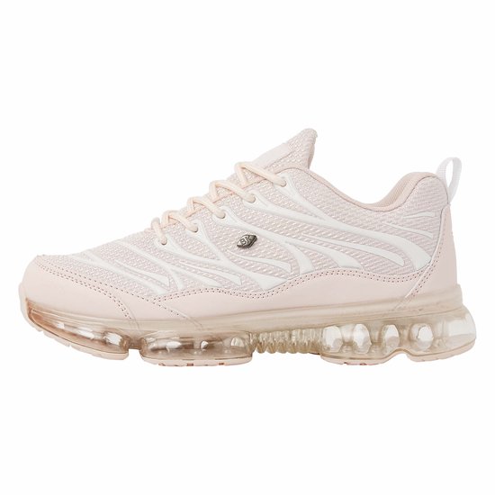 Zijaanzicht van een roze lage sneaker met witte golvende lijnen en doorzichtige zool.