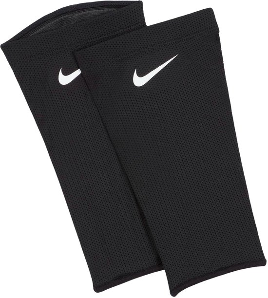 Zwarte manchetten met witte Nike swoosh logo's. Textuur van kleine gaatjes.