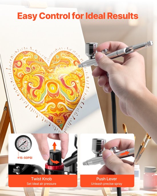 Hand houdt een airbrush vast en spuit verf op een canvas met een hart van oranje en gele cirkels. Bediening met draaiknop en drukknop.