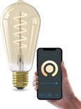 Gouden Edison-lamp met spiraalvormige gloeidraad, bediend met een smartphone.