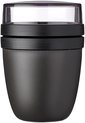 Zwarte Mepal lunchpot met transparante deksel en interne opslag voor muesli.