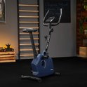 Een marineblauwe hometrainer met 'TREX SPORT' logo in een fitnessruimte.