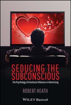 Boek 'Seducing the Subconscious' met een hartvormig patroon op een tv-scherm.
