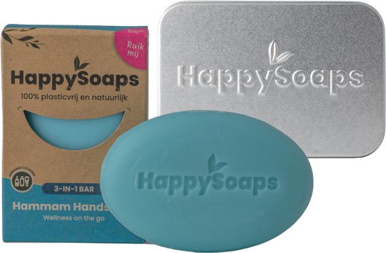 Een blauwe, ovale zeep met "HappySoaps" logo, een kartonnen verpakking en een zilverkleurig bewaarblikje.