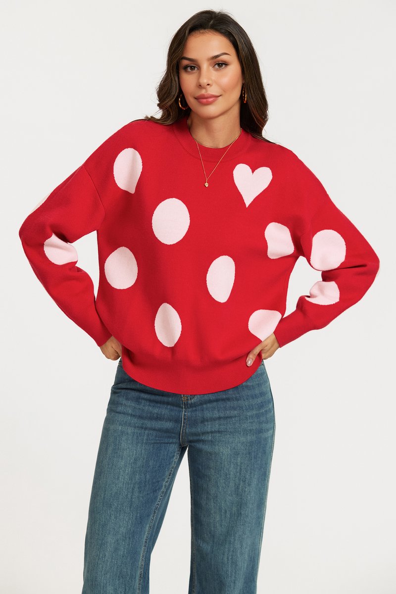 Gebreide trui met hart- en stippenpatroon in rood