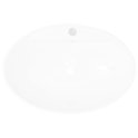 Lavabo ovale en céramique blanc avec trop-plein et trou pour robinet.