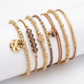 Set van 7 goudkleurige armbanden voor dames met kralen, bedels en bruinaccenten – dames armbanden set in natuurlijke tinten