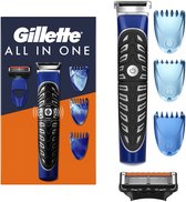 Gillette All In One: blauw apparaat met zwart handvat, 3 blauwe opzetkammen en losse scheerkop.