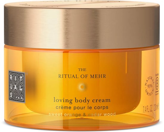 Oranje pot met gouden deksel, met "The Ritual of Mehr" en 'loving body cream sweet orange & cedar wood'.