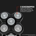 Close-up van 5 roterende scheerkoppen op een zwart Remington hoofdscheerapparaat.