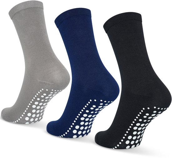 Drie sokken in grijs, donkerblauw en zwart, met witte antislip stippen op de zool.