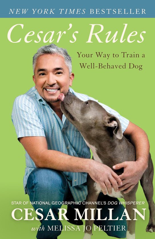 Boek 'Cesar's Rules: Your Way to Train a Well-Behaved Dog' met Cesar Millan en een hond.