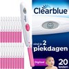 Clearblue digitale ovulatietest met roze handvat. Naast de teststaafjes liggen 20 individuele teststaafjes met roze handvatten.