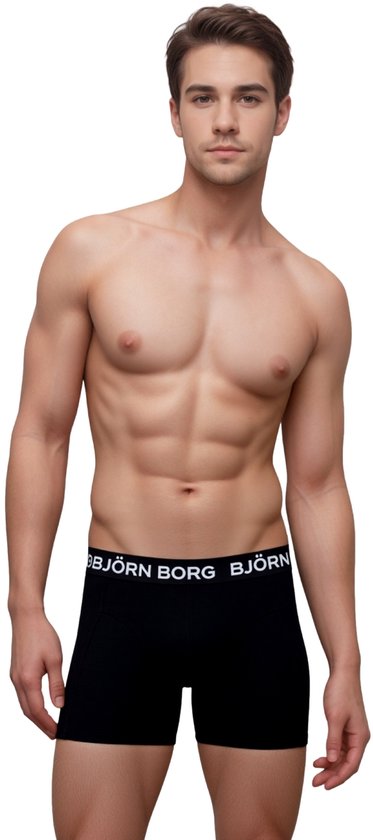 Man met gespierd bovenlichaam, draagt een zwarte Björn Borg boxer met witte merknaam.