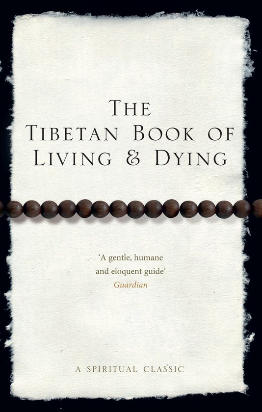 Boek 'The Tibetan Book of Living & Dying' met een rozekransje van bruine kralen.