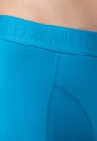 Detailopname van een turquoise Muchachomalo boxershort met op de tailleband het ingeweven "MUCHACHOMALO" logo.