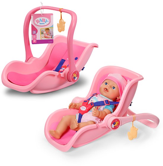Roze draagstoel met zitje en pop. Zwart en blauw harnas. Geel mobieltje.