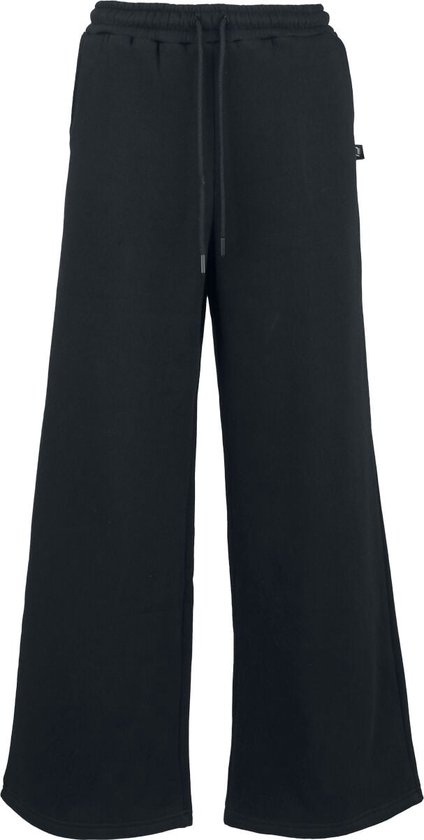 Pantalon de jogging noir ample pour femme avec cordon de serrage.