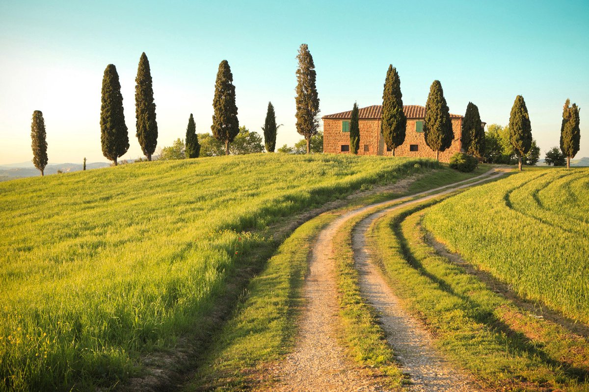 Fotobehang Toscaanse landschap in blauw bruin