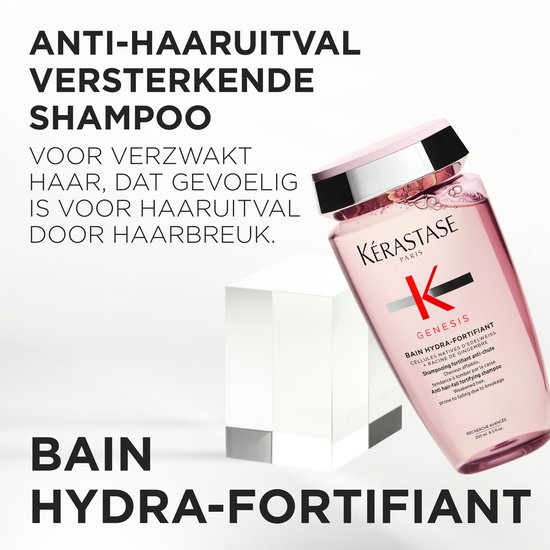 Bouteille rose de shampooing Kérastase Genesis Bain Hydra-Fortifiant avec un bouchon argenté.
