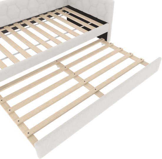 Detail van een uittrekbaar wit slaapbank bedframe.