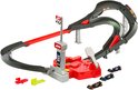 Grijze en rode Hot Wheels F1 racebaan met startpoort, lanceerder en drie F1 auto's.