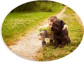 PVC Schuimplaat Ovaal - Peuter Lopend met Bruine Hond door het Bos - 28x21 cm Foto op Ovaal (Met Ophangsysteem)