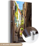 MuchoWow® Glasschilderij 100x150 cm - Schilderij acrylglas - Straat tussen huizen in Provence - Foto op glas - Schilderijen