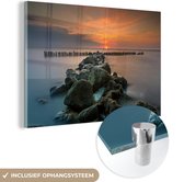 MuchoWow® Glasschilderij 120x80 cm - Schilderij acrylglas - Zee - Zon - Stenen - Foto op glas - Schilderijen