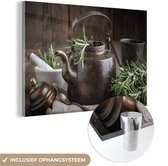 MuchoWow® Glasschilderij 150x100 cm - Schilderij acrylglas - Thee - Theepot - Kruiden - Foto op glas - Schilderijen