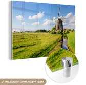 MuchoWow® Glasschilderij 120x80 cm - Schilderij acrylglas - Molen - Gras - Nederland - Foto op glas - Schilderijen