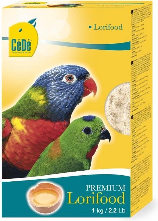Gele verpakking met "CéDé" logo, twee kleurrijke loripapegaaien, "PREMIUM Lorifood 1kg" en een eidooier.