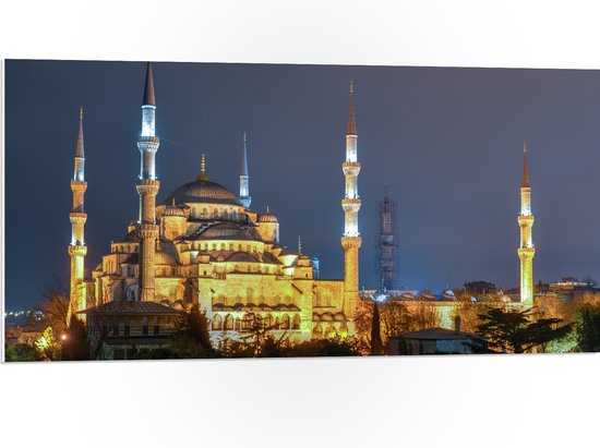 WallClassics - PVC Schuimplaat - Sultan AhmetMoskee in de Nacht in Istanbul, Turkije - 100x50 cm Foto op PVC Schuimplaat (Met Ophangsysteem)
