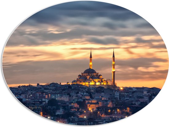 WallClassics - PVC Schuimplaat Ovaal - Süleymaniye-Moskee op Begin van de Avond in Istanbul, Turkije - 96x72 cm Foto op Ovaal (Met Ophangsysteem)