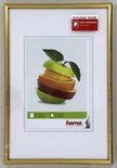 Gouden fotolijst met witte passe-partout en afbeelding van appels.