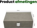 Grijze stoffen box met "Recalma" logo, gesloten. Afmetingen: 21 cm breed, 13 cm diep, 6 cm hoog.